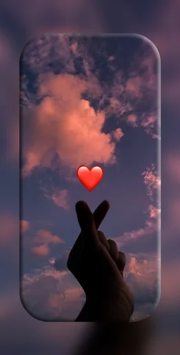 Sunset sky finger heart wallpaper with silhouette hand gesture and red heart icon for mobile