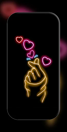 Neon pink and yellow finger heart wallpaper with glowing hand gesture on black background