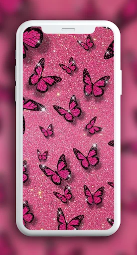 Pink sparkly butterfly wallpaper with black butterflies on mobile phone display